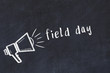 Chalk sketch of loudspeaker and inscription field day