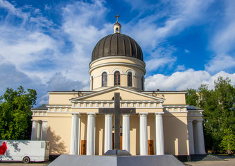 Wall Mural - Cathedral of Christ's Nativity surrounded by trees under a blue cloudy sky in Chisinau, Moldova