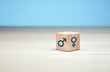 © Cagkan - Male and female gender icons against blue background. Gender equality concept.