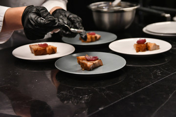 Sticker - Professional chef making grilled pork pieces with sausage