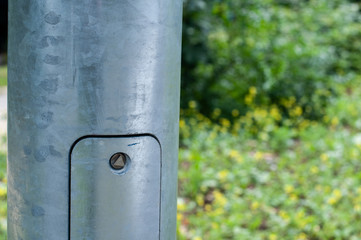 close-up of a service opening at a street lamp