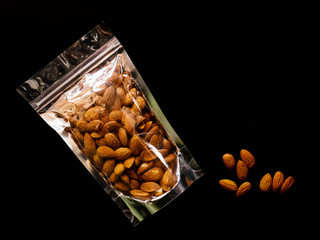 Wall Mural - Almonds isolated on background, nut beans