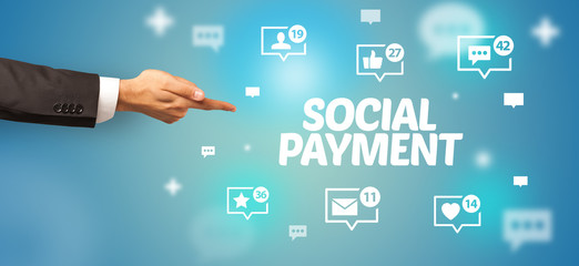 close-up of cropped hand pointing at social payment inscription, social networking concept