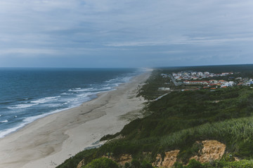 Poster - Beautiful aerial view of sandy beach with turquoise water and cloudy sky