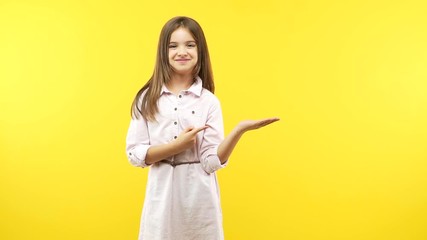 funny little child girl holding something with hand