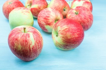 apples with a red barrel on the table