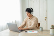 © One - One man working remotely and a cat.