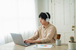 © One - One man working remotely and a cat.