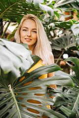 Sticker - Woman in swimsuit on tropical plants background