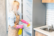 © Angelov - Young woman doing housework, cleaning the kitchen