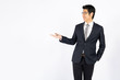 © khwanchai - Asian and Thai man, smart and cheerful businessman show hand to present isolated on white background