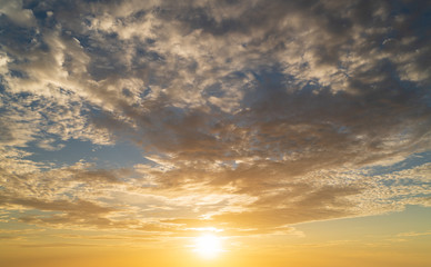 Wall Mural - abstract amazing scene of stuning colorful sunset with clouds background in nature and travel concep