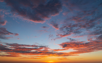 Wall Mural - abstract amazing scene of stuning colorful sunset with clouds background in nature and travel concep