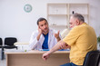 © Elnur - Old patient visiting young male doctor