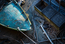 Top View Of A Old Boats Crashed To The Surface Of The Shore, Black Albatross Trapped In The Ruins, Did Not Survive.
