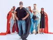 © ASDF - confident guy in a Superman Cape standing in front of his team