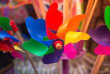 Closeup Of Colorful Pinwheels In A Market Under The Sunlight With A Blurry Background