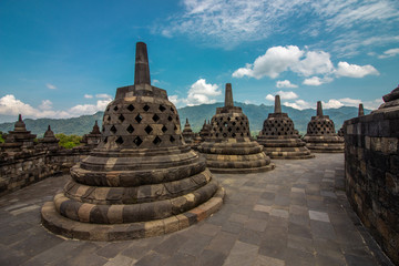 Taman Lumbini park from the height of the temple complex Candi Borobudur at sunny day. Candi Borobudur, Yogyakarta, Jawa, Indonesia.