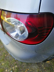 Poster - Vertical shot of car rear light