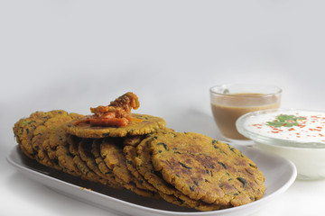 Wall Mural - Masala Bhakhri or Roti is Indian flatbread served with curd,tea or Pickle in breakfast.