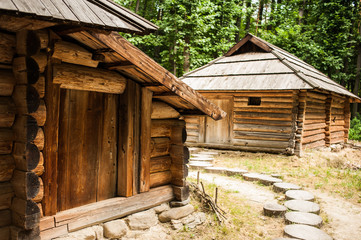 Old authentic wooden house with logs