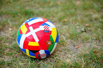 Sticker - Closeup shot of a soccer ball with flags