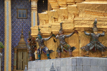 Wall Mural - Bangkok 4 August 2020: colorful giants and monkeys Carrying the golden pagoda are unique work of art in the Grand Palace or Wat Phra Kaew. Best Place to Visit in Bangkok, Thailand.