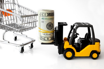 Mini forklift truck load stack of banknotes usa on Shopping cart. Logistics, transportation, management ideas, Industry business commercial concept.