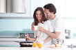 © alotofpeople - Couple cooking breakfast