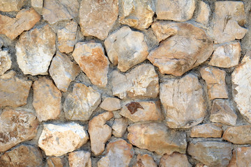 Canvas Print - Closeup shot of a wall with stones