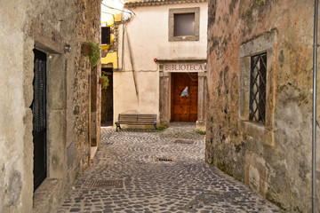 A narrow street among the old houses of Giuliano di Roma, a rural village in the Lazio region.