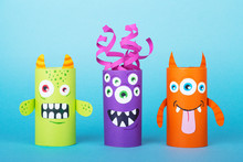 Paper Monsters On A Blue Background. Handmade Concept, Creative Idea From Toilet Tube