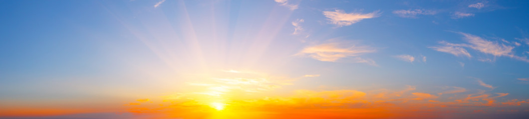 Wall Mural - sky panorama with bright sun and clouds