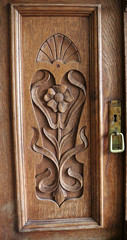 Wall Mural - Vertical shot of a decorative wooden door with carvings