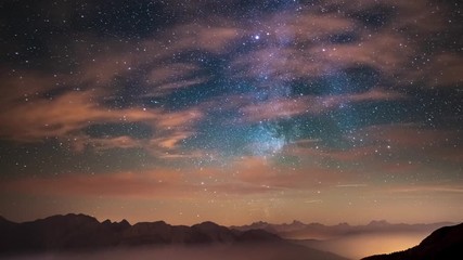 Wall Mural - time lapse: the milky way and stars over the majestic italian french alps in summertime. small meteo