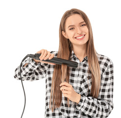 Sticker - Young woman with straightening iron on white background