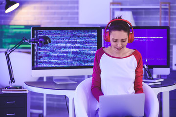 Wall Mural - Female programmer in office at night
