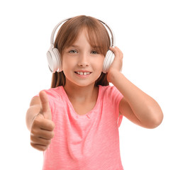 Canvas Print - Little girl listening to music on white background