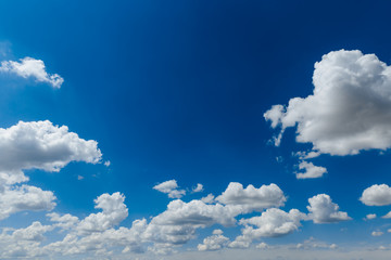 Wall Mural - white, fluffy clouds in blue sky. background from clouds. copy space.