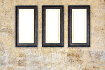 Wall Mural - Three empty picture frames on old stucco wall