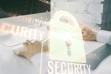 Poster - Double exposure of creative lock hologram with chip and hands typing on laptop on background. Information security concept
