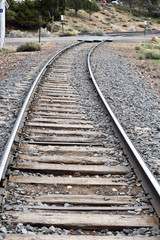 Sticker - Vertical shot of an empty railway track at daytime