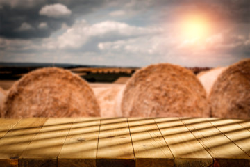 Wall Mural - Autumn wooden table at sunset