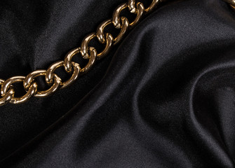 luxury black wavy silk texture with frame of chain background