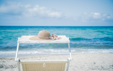 Poster - Sunbed on the sandy beach near the sea. Summer holidays and vacation concept. Inspirational tropical beach

