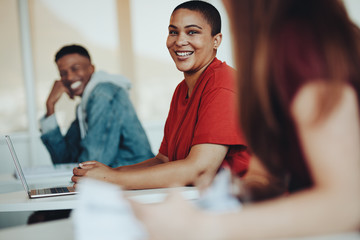 Students chatting in high school classroom