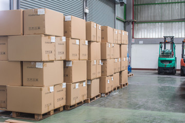 The product box on pallet with forklift in warehouse