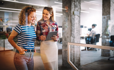 Business people having fun and chatting at workplace office