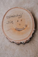 original round mug coaster made of birch wood with a positive inscription in Polish