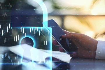 Poster - Businessman hand using smartphone with glowing business chart